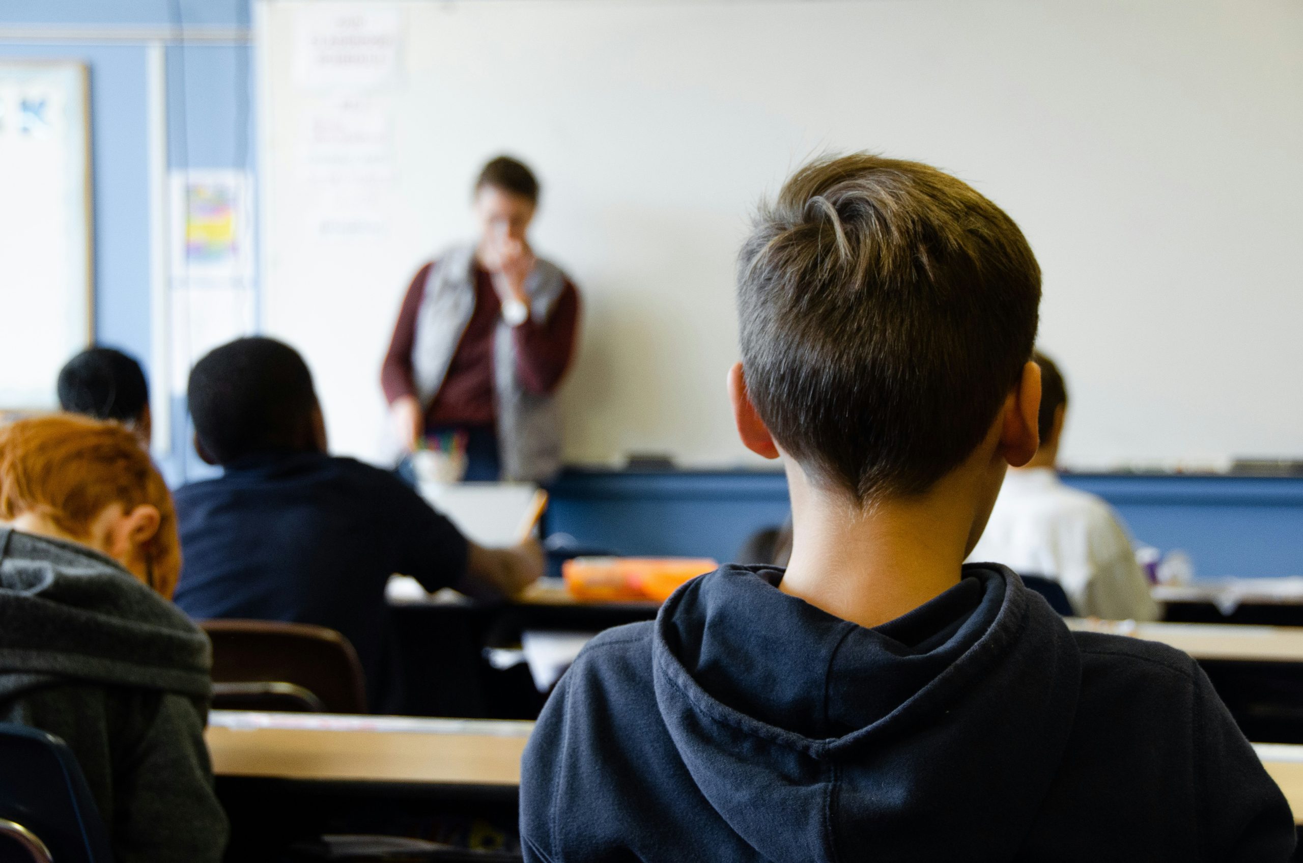 back of pupils head in classroom